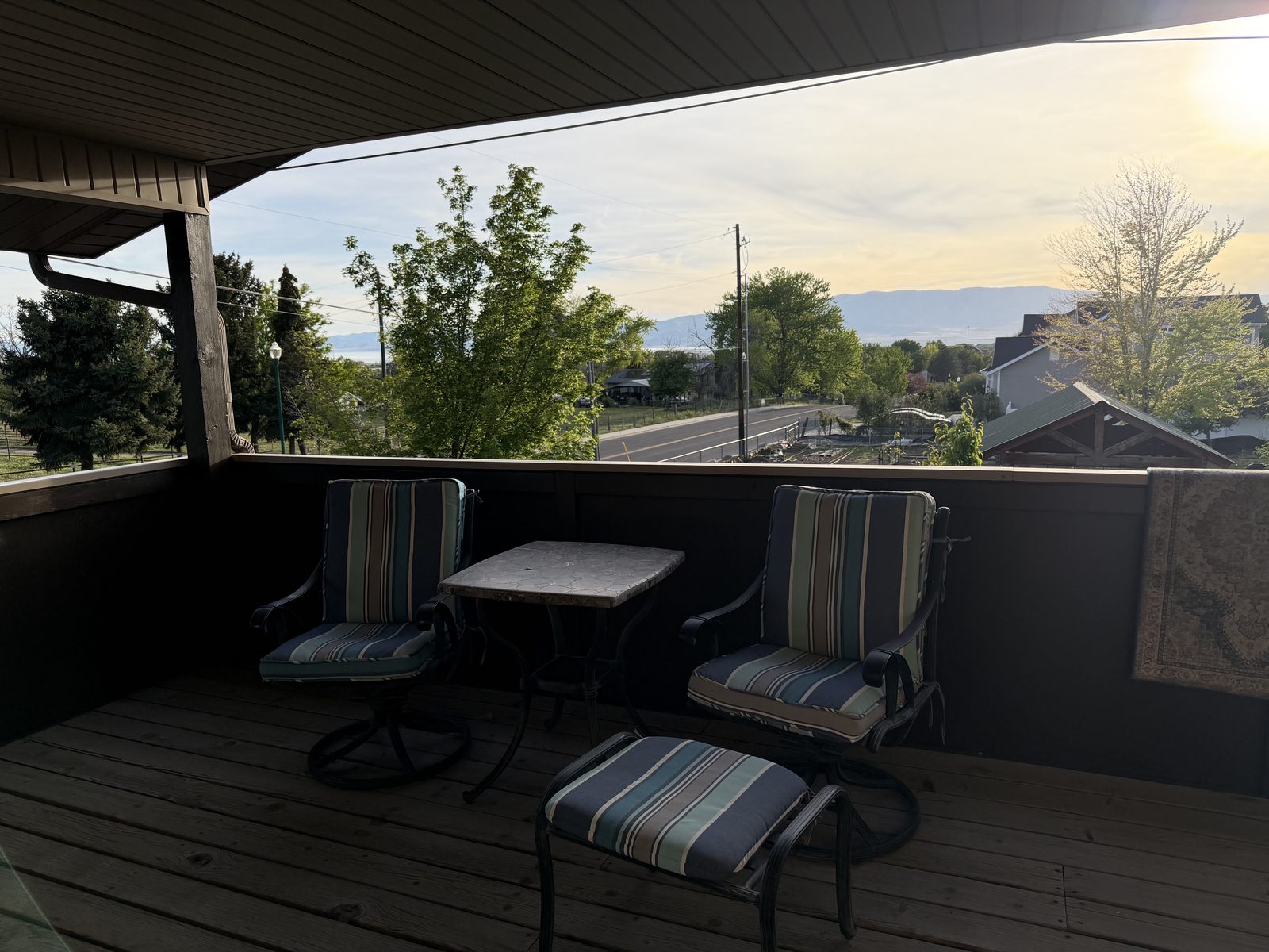 Covered deck with sunset view